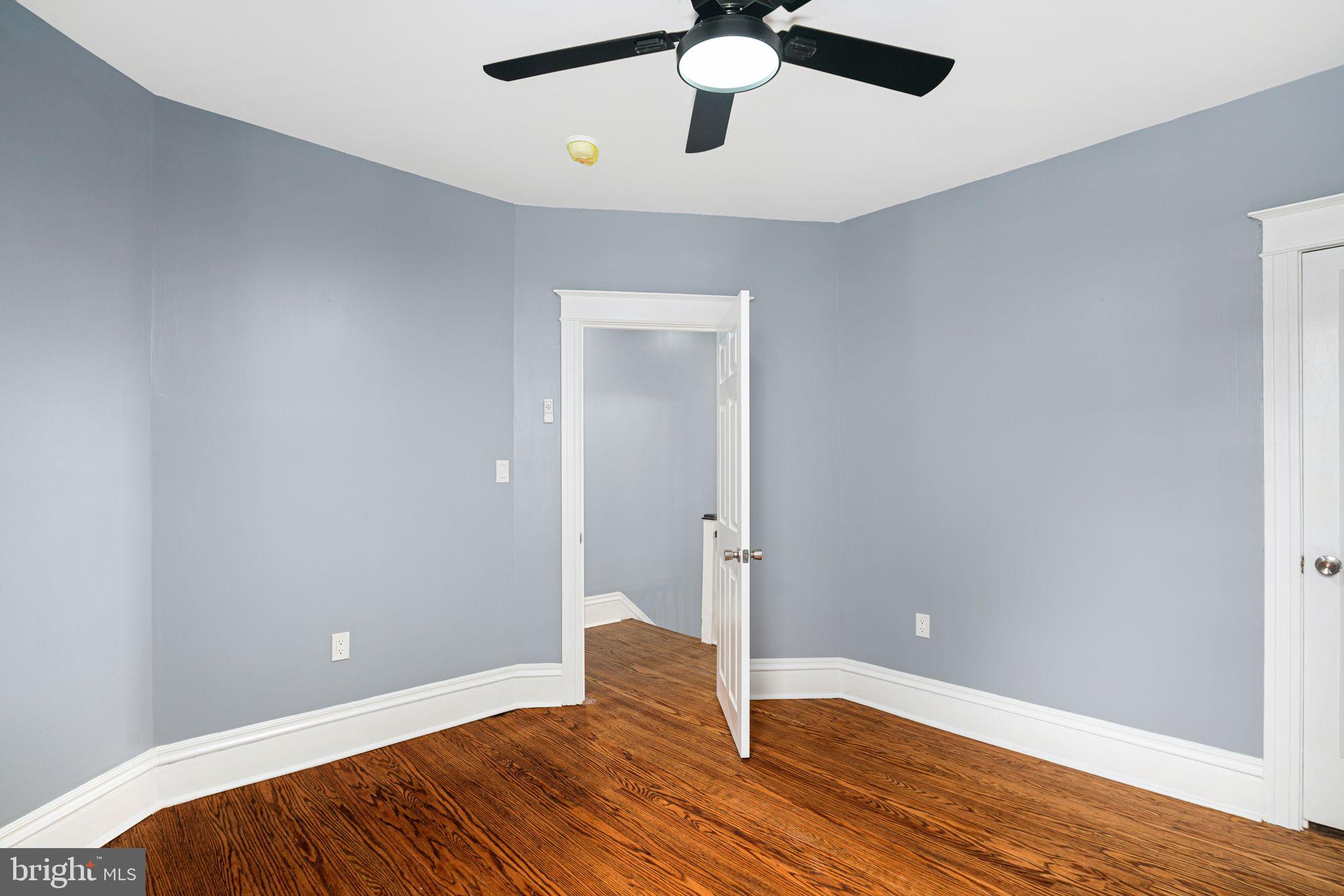 452 South 48th Street Philadelphia, PA 19143 - Photo 27 of 60 a view of an empty room and wooden floor