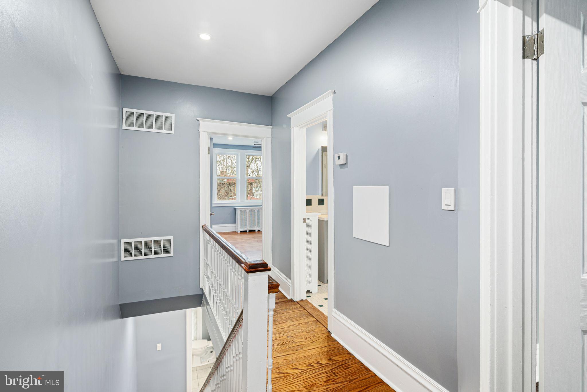 452 South 48th Street Philadelphia, PA 19143 - Photo 33 of 60 a hallway with wooden floor and staircase