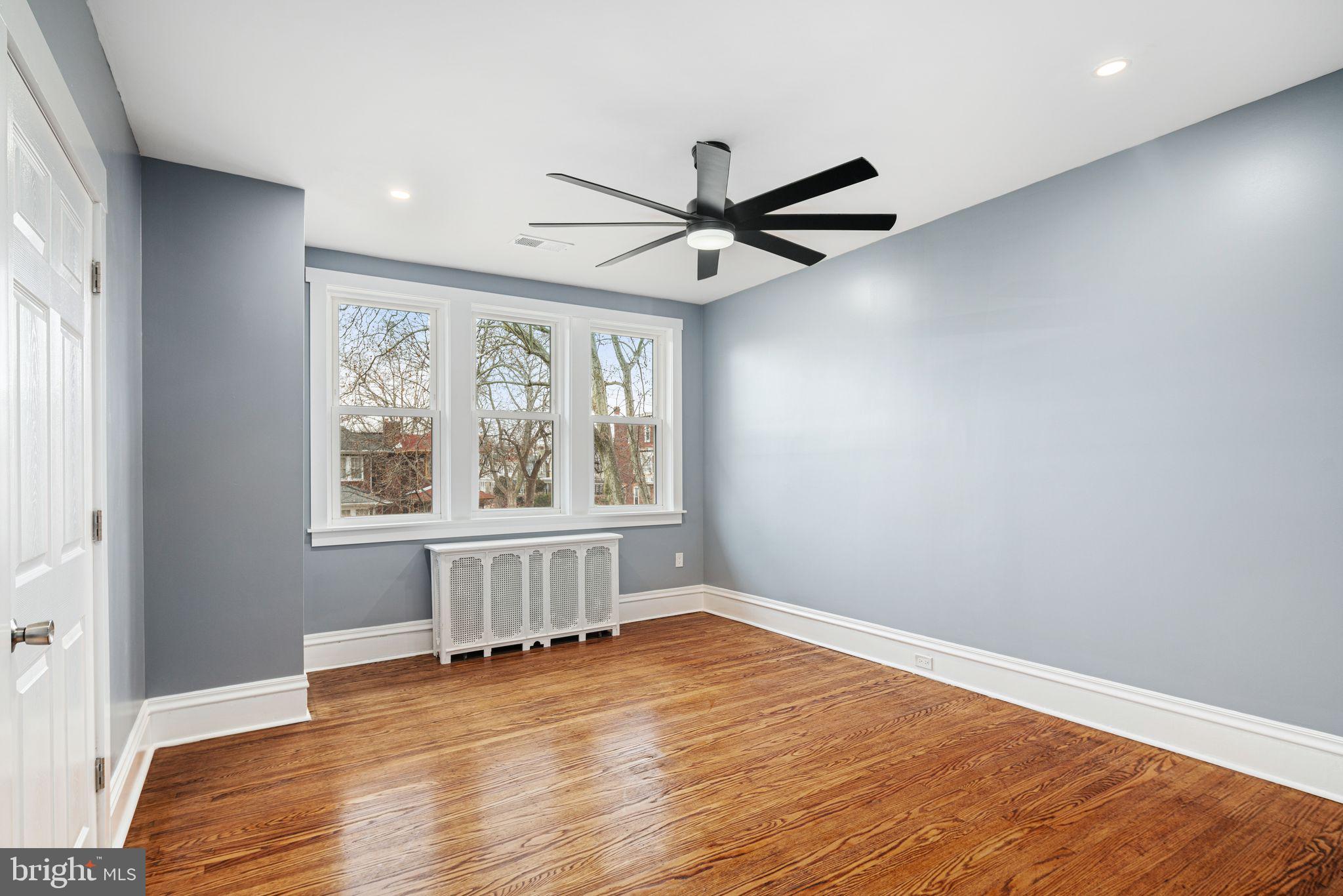 452 South 48th Street Philadelphia, PA 19143 - Photo 34 of 60 wooden floor in an empty room with a window