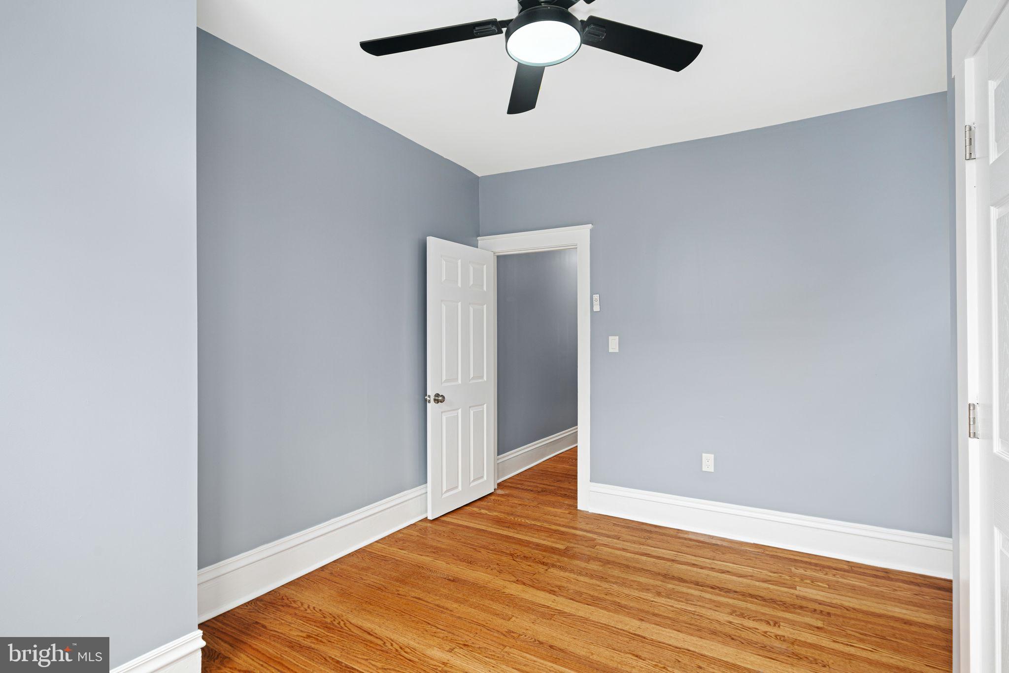 452 South 48th Street Philadelphia, PA 19143 - Photo 36 of 60 a view of an empty room with wooden floor