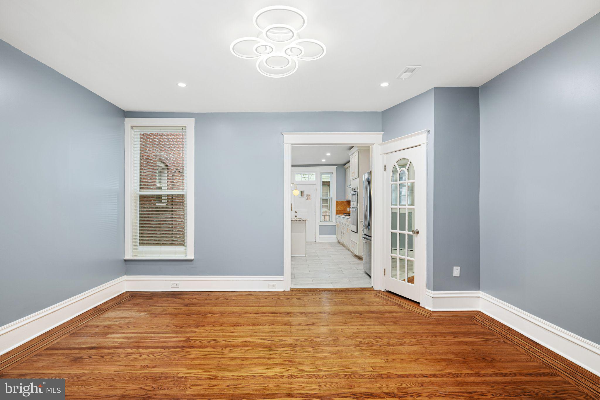 452 South 48th Street Philadelphia, PA 19143 - Photo 39 of 60 a view of an empty room with wooden floor and a window