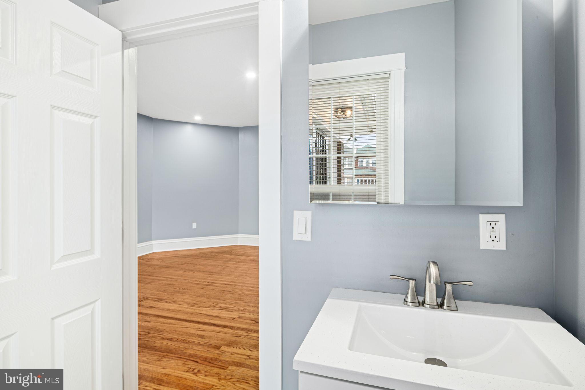 452 South 48th Street Philadelphia, PA 19143 - Photo 42 of 60 a bathroom with a sink and a window
