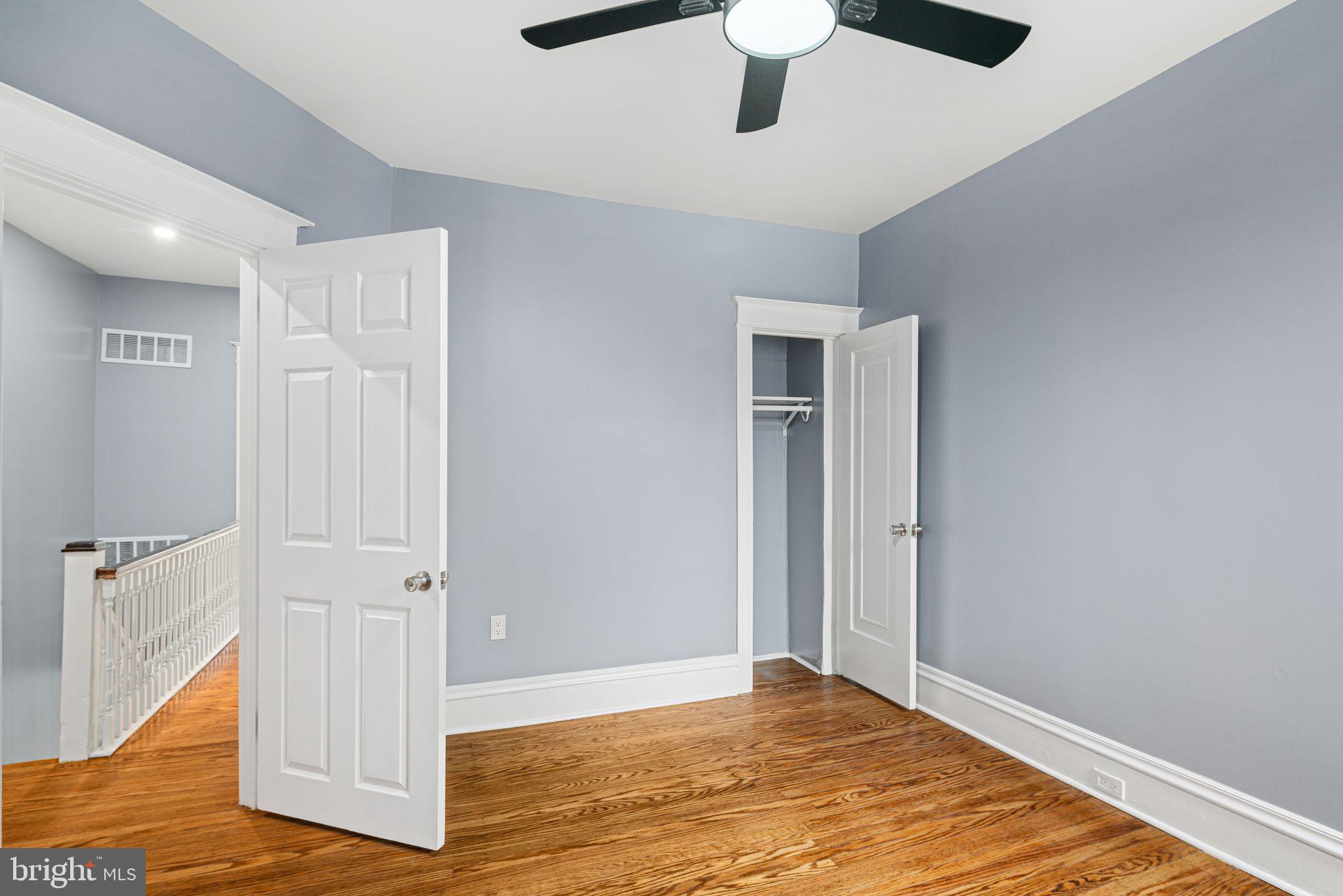 452 South 48th Street Philadelphia, PA 19143 - Photo 43 of 60 a view of an empty room with wooden floor and a ceiling fan