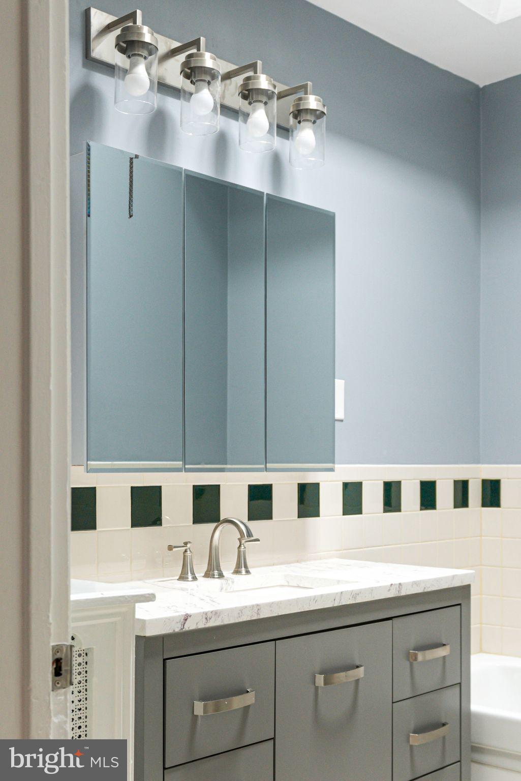 452 South 48th Street Philadelphia, PA 19143 - Photo 48 of 60 a bathroom with a sink and a mirror