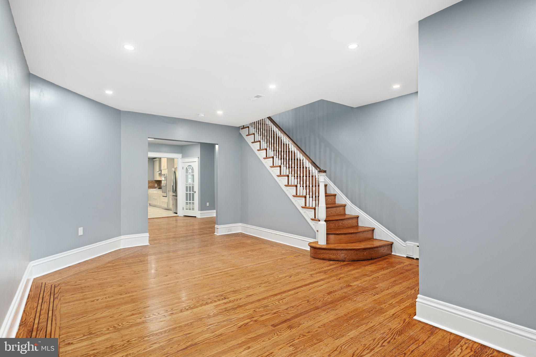 452 South 48th Street Philadelphia, PA 19143 - Photo 6 of 60 a view of an empty room with wooden floor and stairs