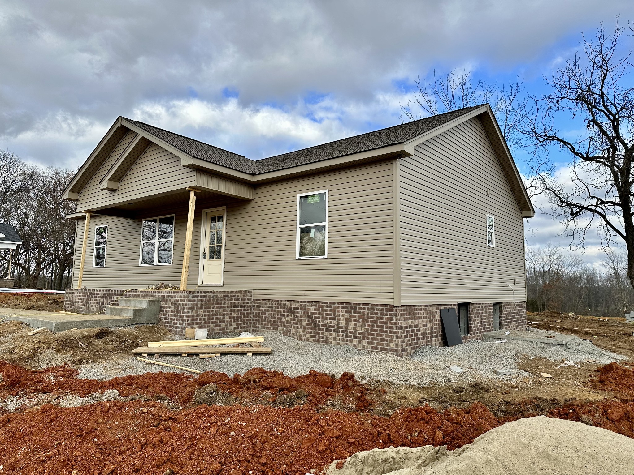 347 A Jim Courtney Road Portland, TN 37148 - Photo 3 of 16 a front view of a house with a yard