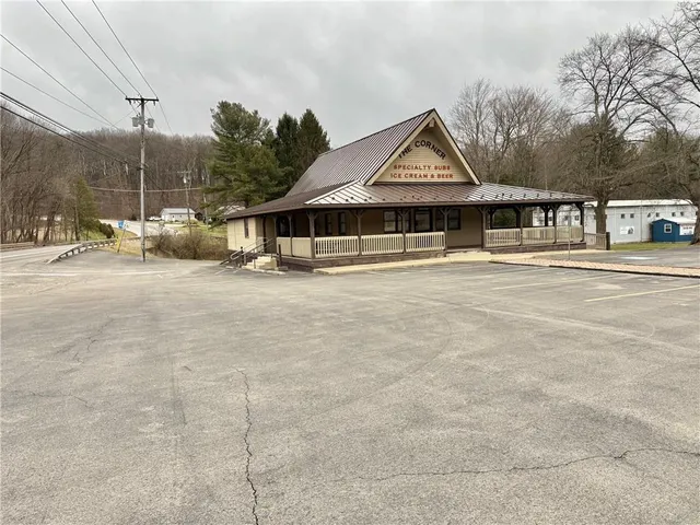 a view of a house next to a yard
