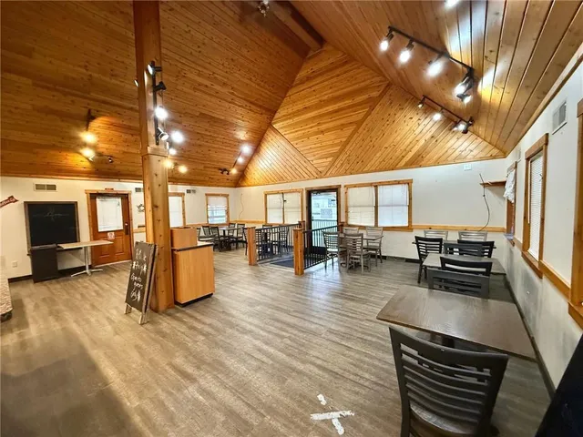 a lobby with furniture and floor to ceiling window