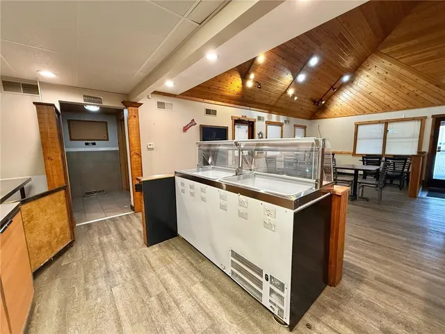 a view of a patio with table and chairs a barbeque