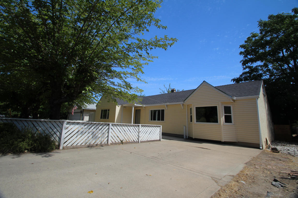 4569 Cedars Road Redding, CA 96001 - Photo 1 of 22 a front view of a house with a yard and garage
