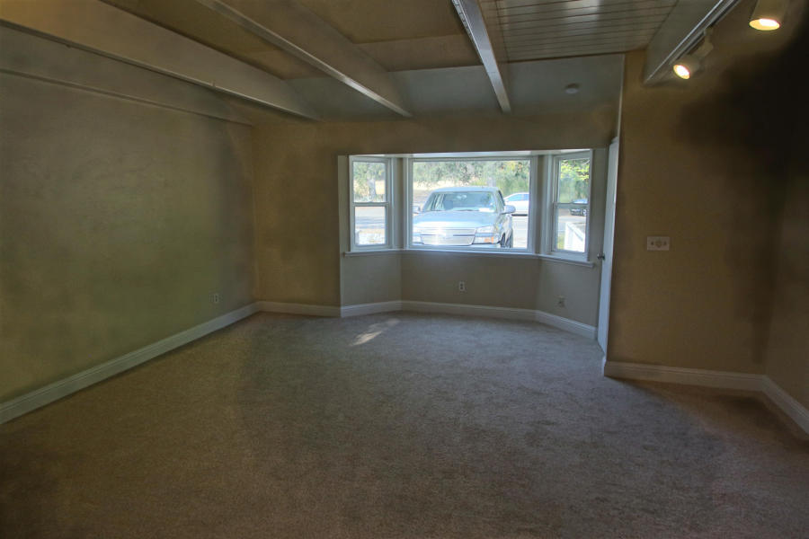 4569 Cedars Road Redding, CA 96001 - Photo 15 of 22 an empty room with windows