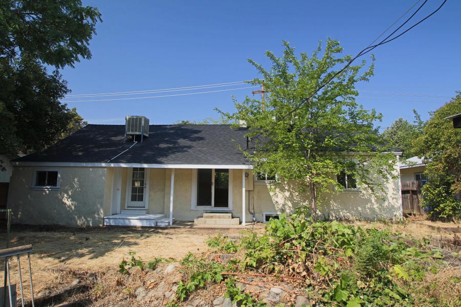 4569 Cedars Road Redding, CA 96001 - Photo 21 of 22 a front view of a house with garden
