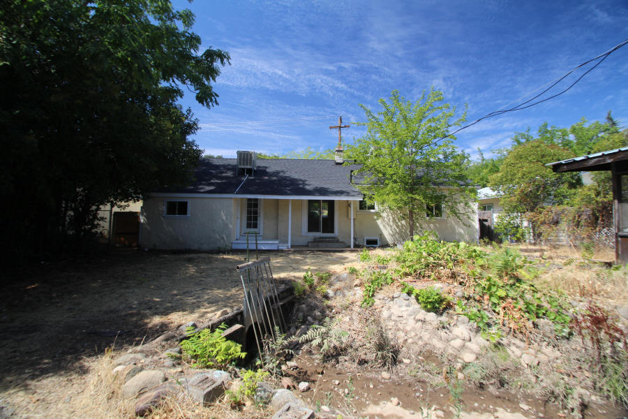 4569 Cedars Road Redding, CA 96001 - Photo 22 of 22 a view of a house with a yard