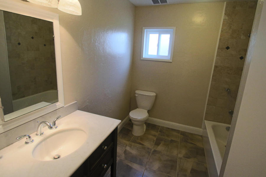 4569 Cedars Road Redding, CA 96001 - Photo 5 of 22 a bathroom with a sink toilet and shower