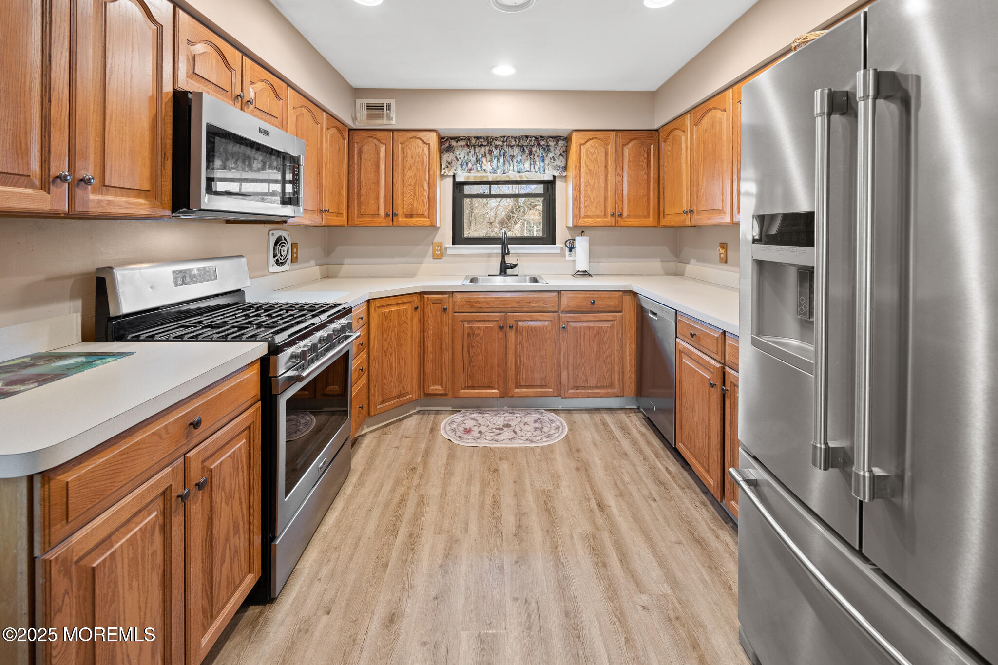 17 Garden Way Howell, NJ 07731 - Photo 12 of 54 a kitchen with stainless steel appliances granite countertop a stove a sink dishwasher and a refrigerator
