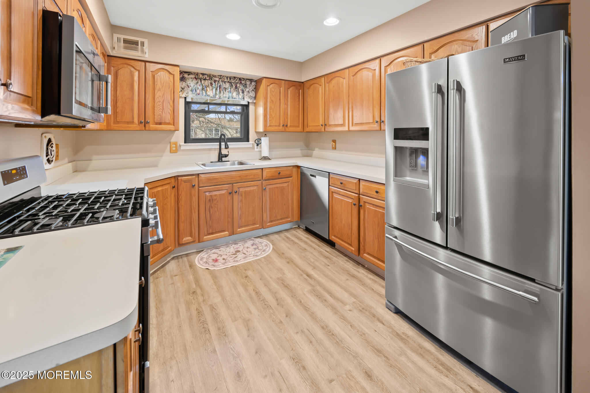 17 Garden Way Howell, NJ 07731 - Photo 13 of 54 a kitchen with stainless steel appliances a refrigerator sink and cabinets