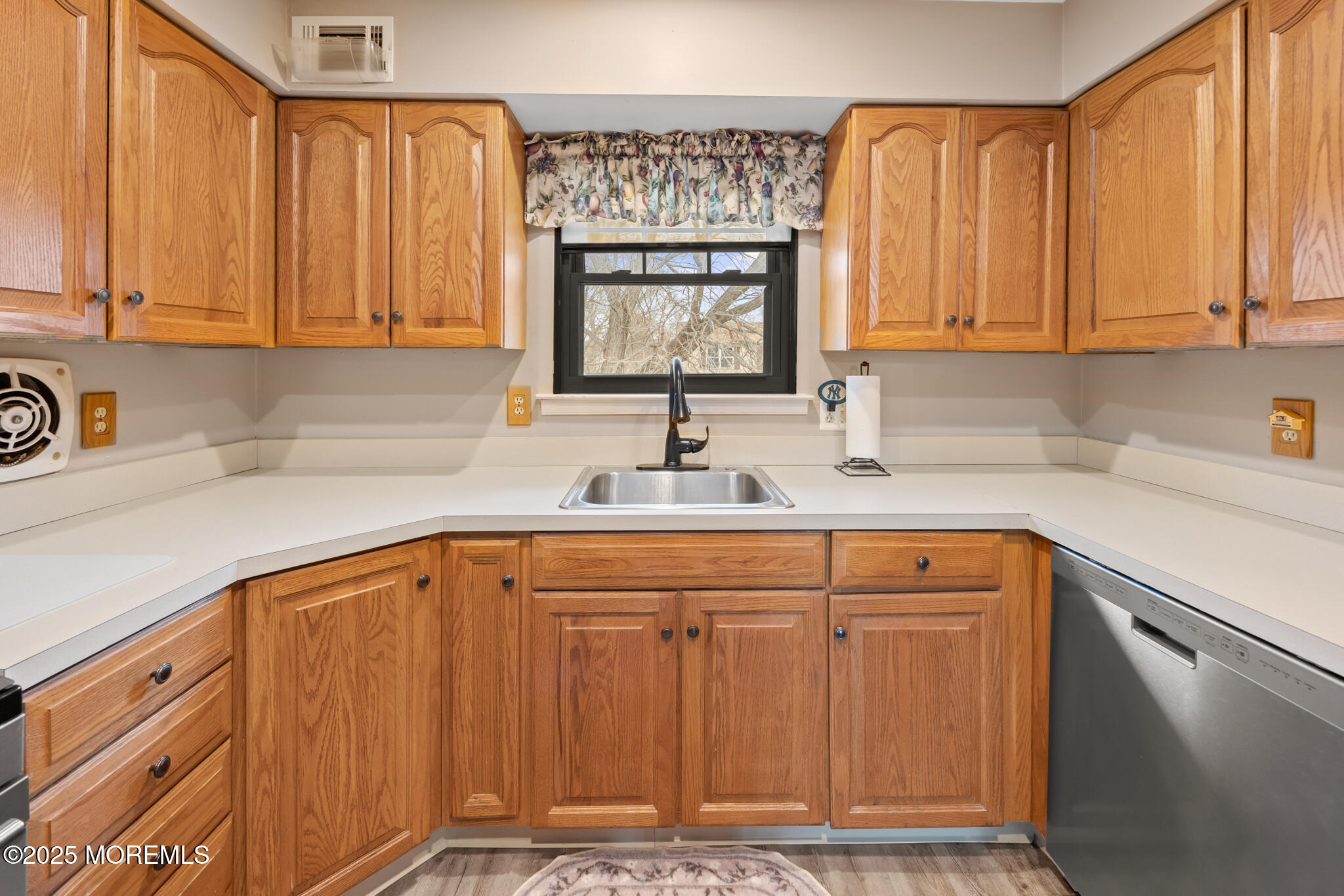 17 Garden Way Howell, NJ 07731 - Photo 14 of 54 a kitchen with stainless steel appliances a sink cabinets and a window