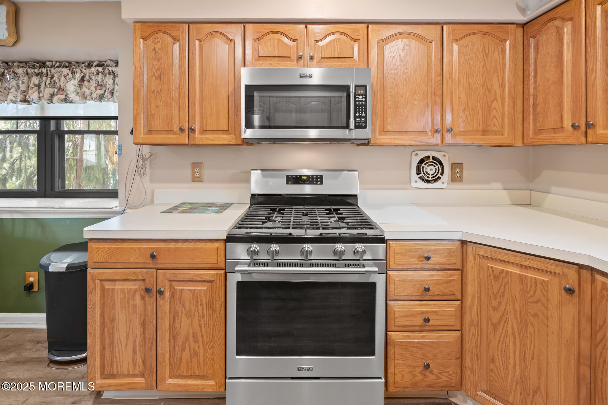 17 Garden Way Howell, NJ 07731 - Photo 15 of 54 a kitchen with granite countertop white cabinets and stainless steel appliances