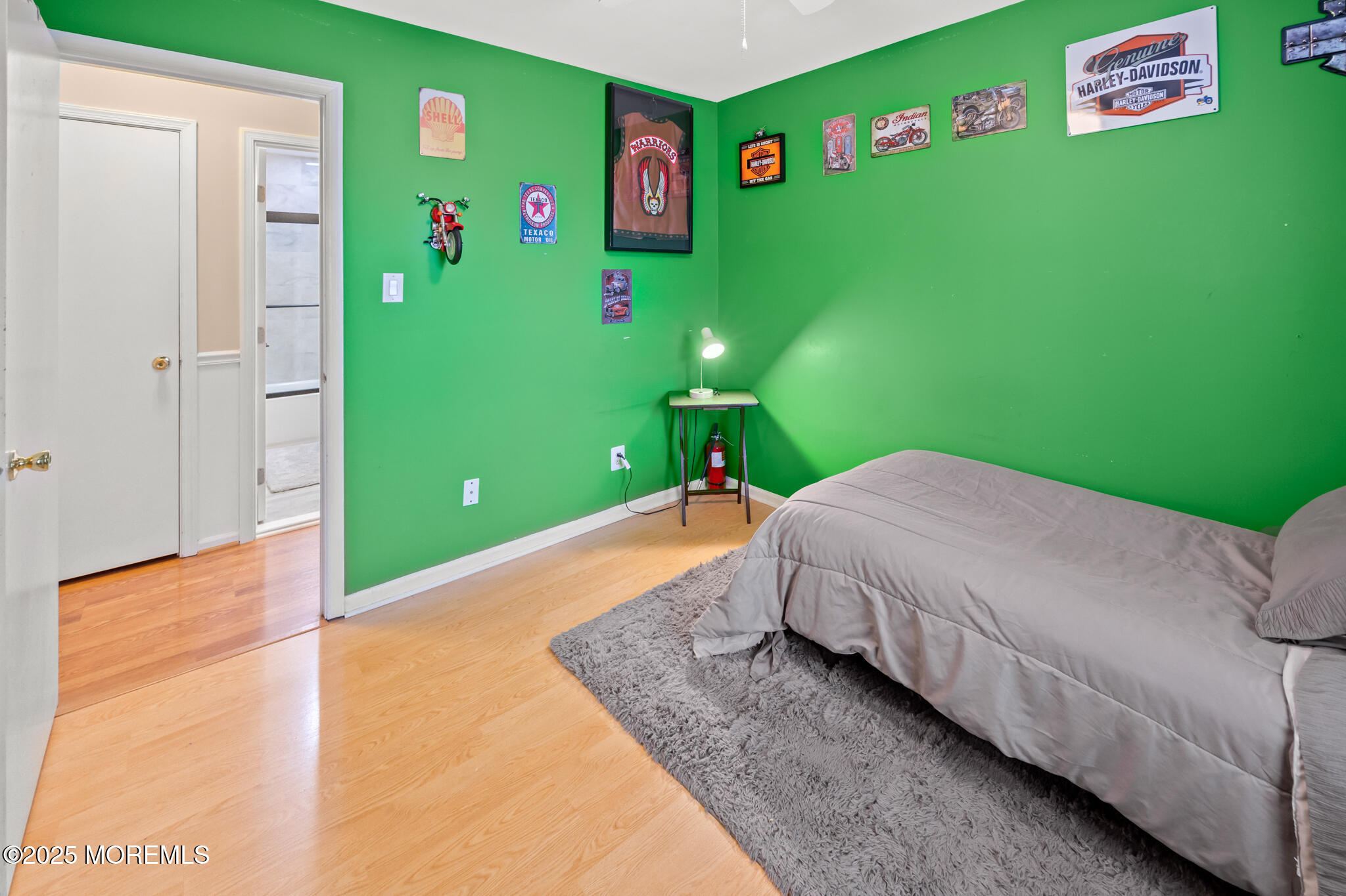 17 Garden Way Howell, NJ 07731 - Photo 25 of 54 a bedroom with a bed table and a refrigerator