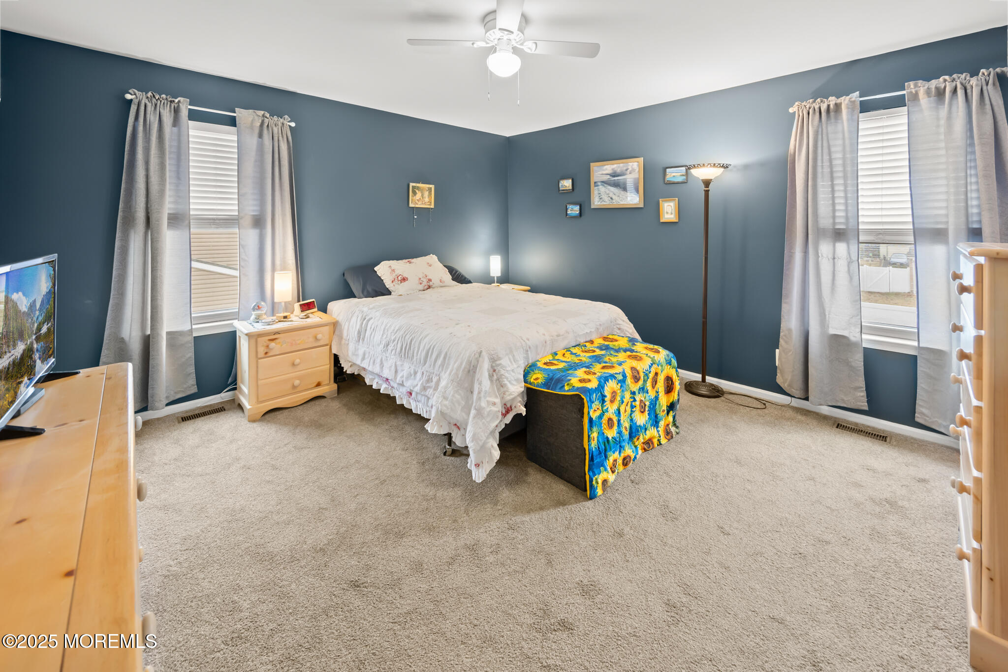 17 Garden Way Howell, NJ 07731 - Photo 28 of 54 a bedroom with a bed and a chandelier