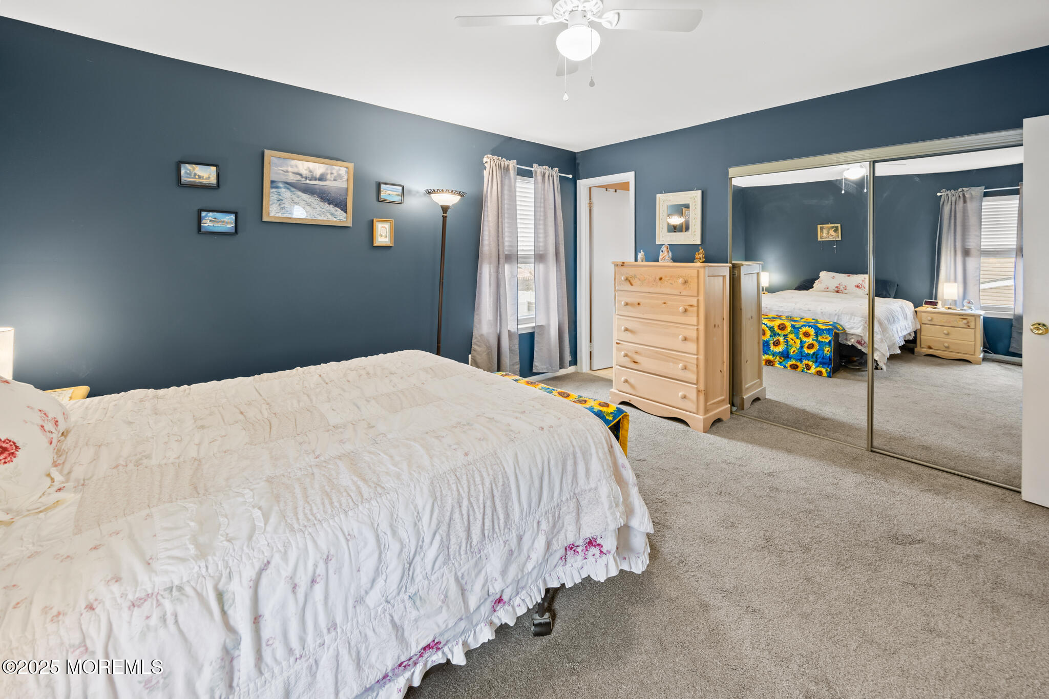 17 Garden Way Howell, NJ 07731 - Photo 29 of 54 a bed room with a bed mirror and a walk in closet