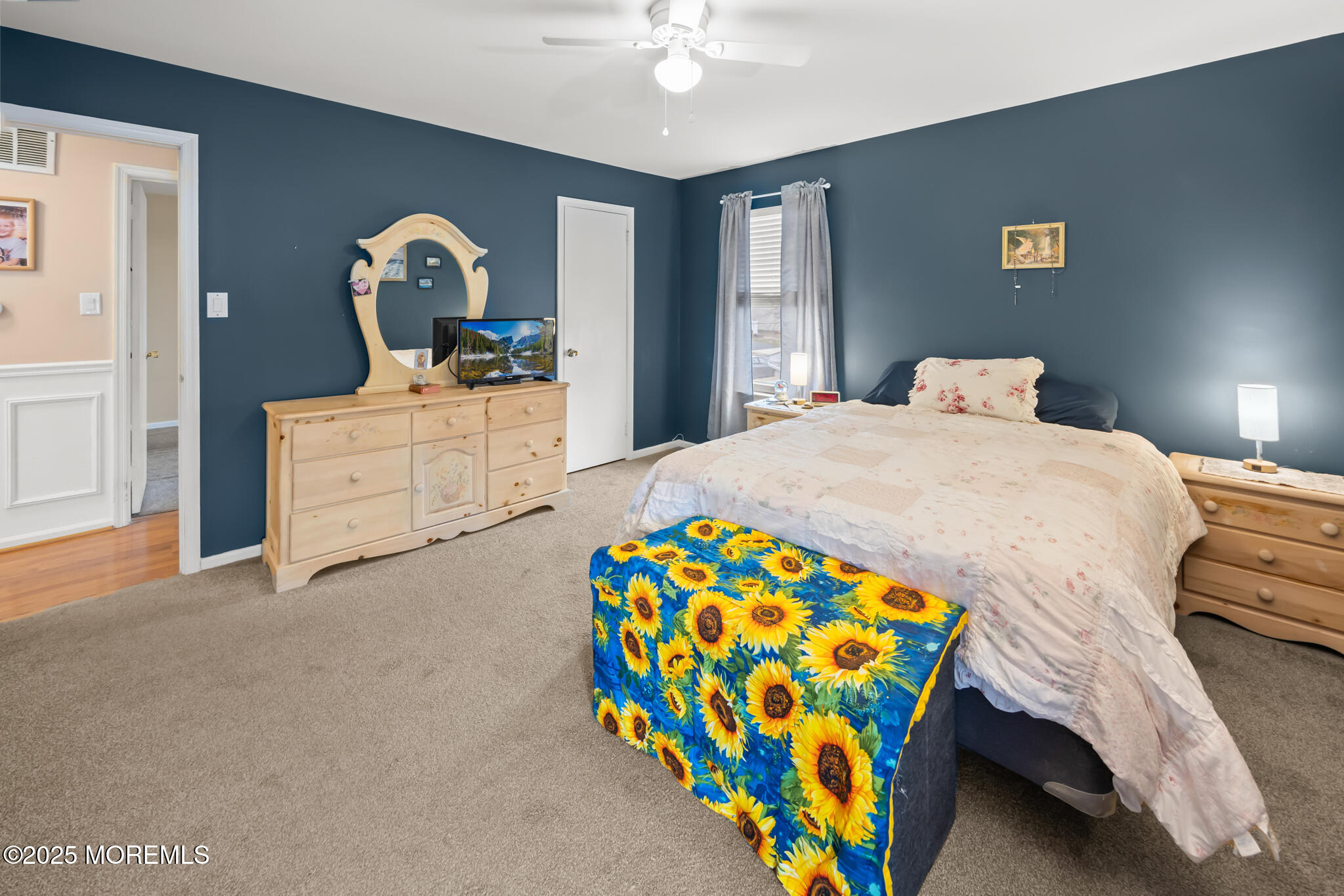 17 Garden Way Howell, NJ 07731 - Photo 30 of 54 a bedroom with a bed and a chandelier