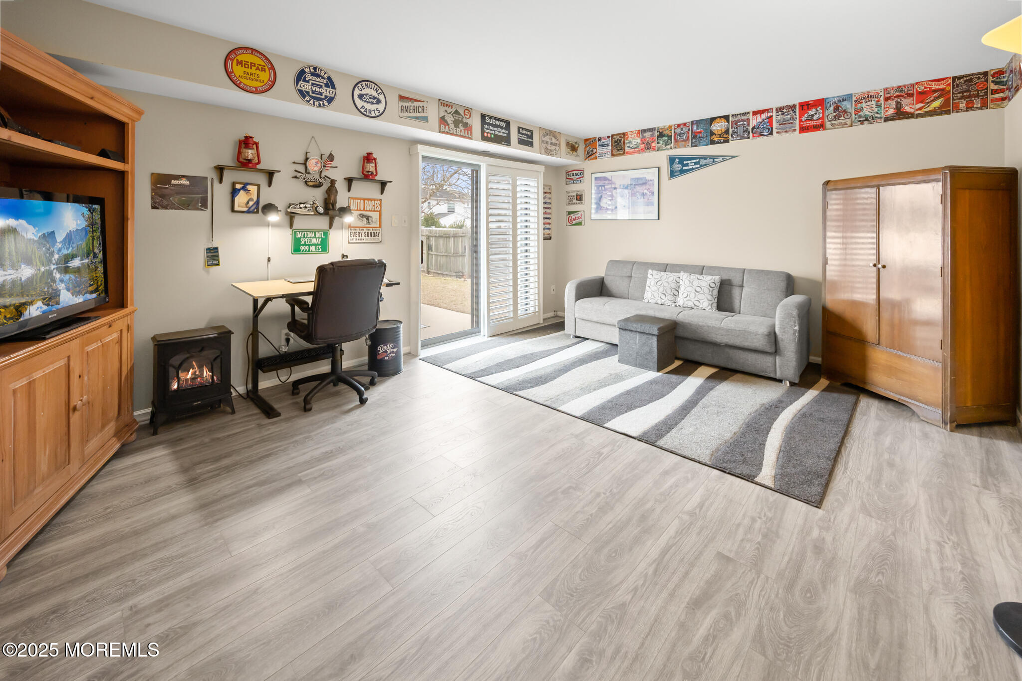 17 Garden Way Howell, NJ 07731 - Photo 35 of 54 a living room with furniture and a flat screen tv