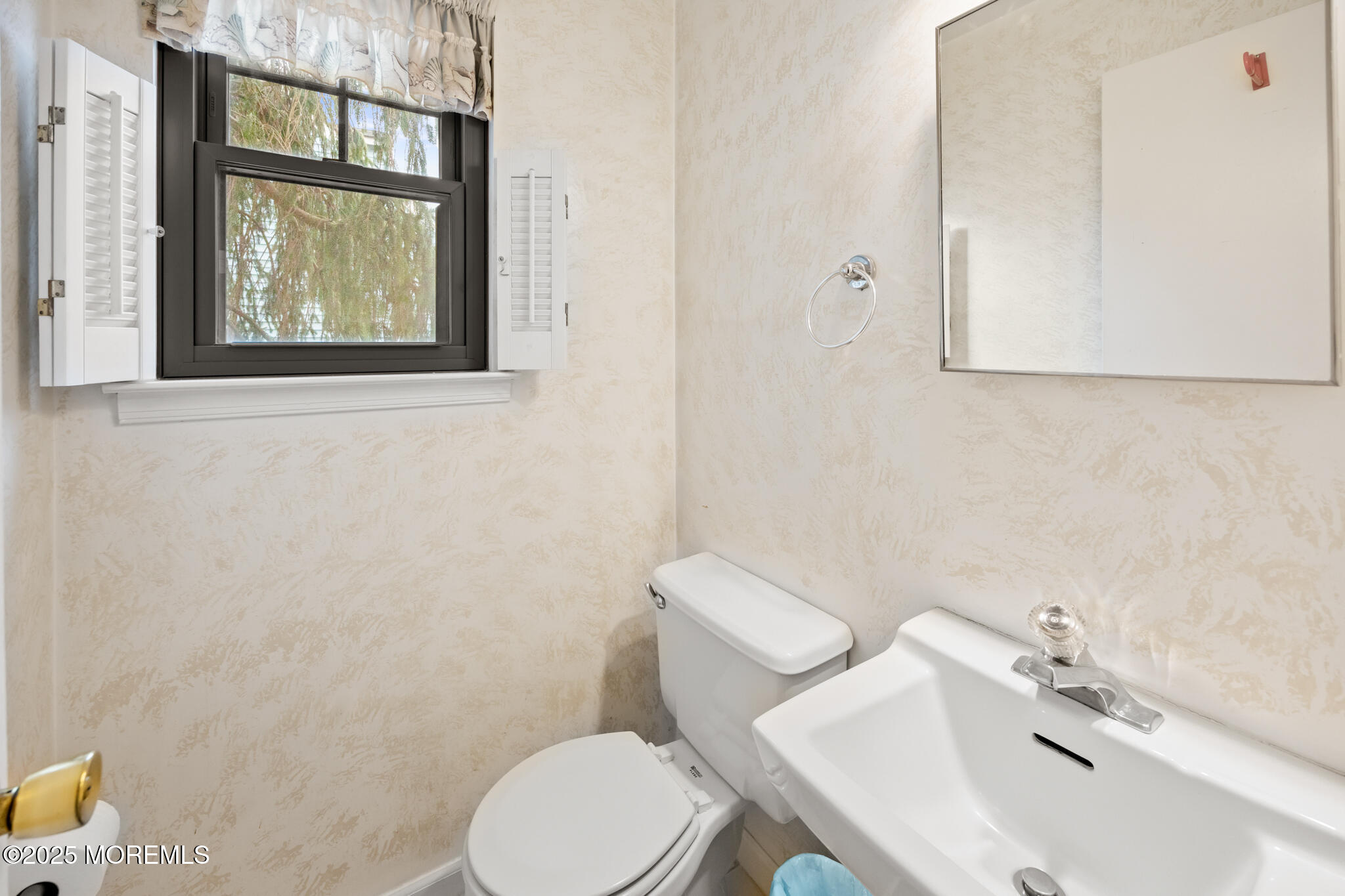 17 Garden Way Howell, NJ 07731 - Photo 39 of 54 a bathroom with a toilet a sink and mirror