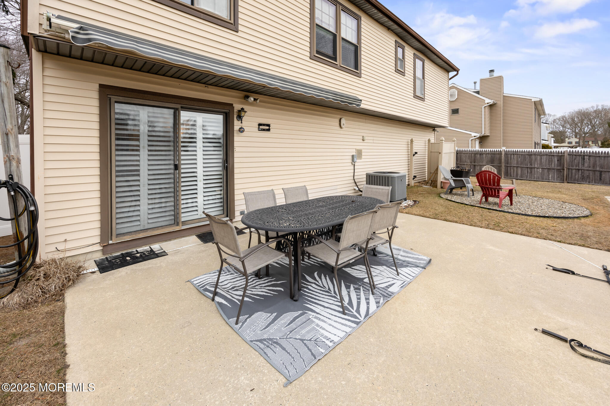 17 Garden Way Howell, NJ 07731 - Photo 45 of 54 a view of a patio with table and chairs and wooden floor