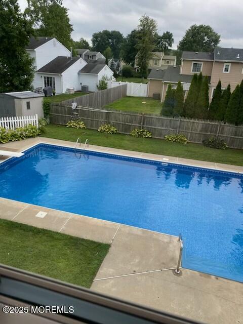 17 Garden Way Howell, NJ 07731 - Photo 48 of 54 a view of swimming pool with seating area and small yard