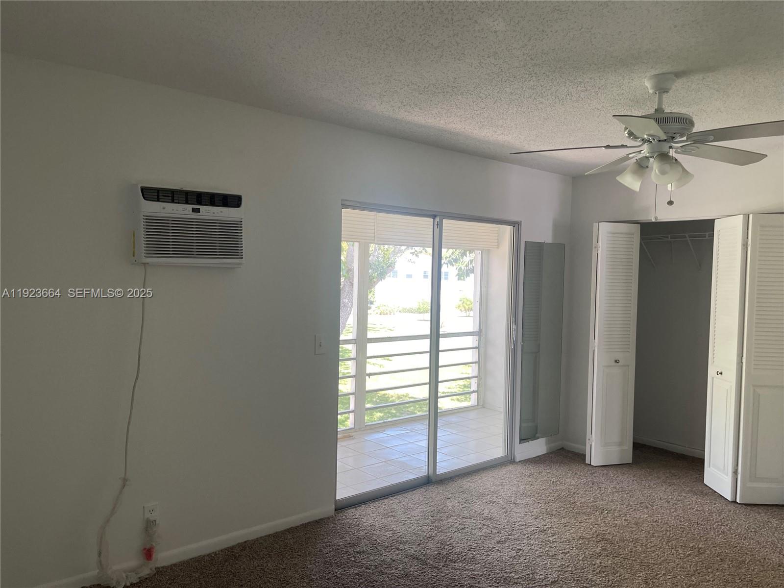 119 Tilford F, Unit 119 Deerfield Beach, FL 33442 - Photo 17 of 36 a view of an empty room with a window