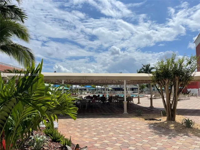 a view of a chairs and table in patio