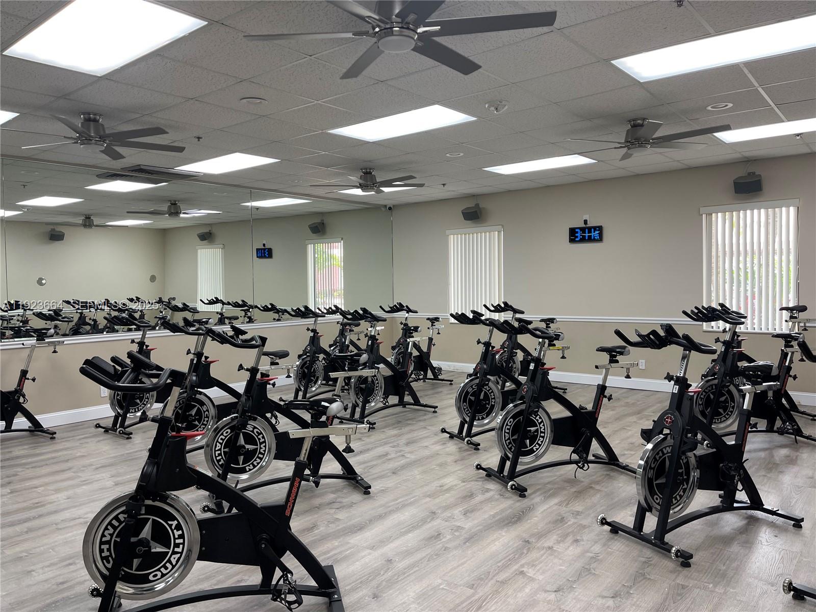 119 Tilford F, Unit 119 Deerfield Beach, FL 33442 - Photo 27 of 36 a very nice looking room with gym equipment