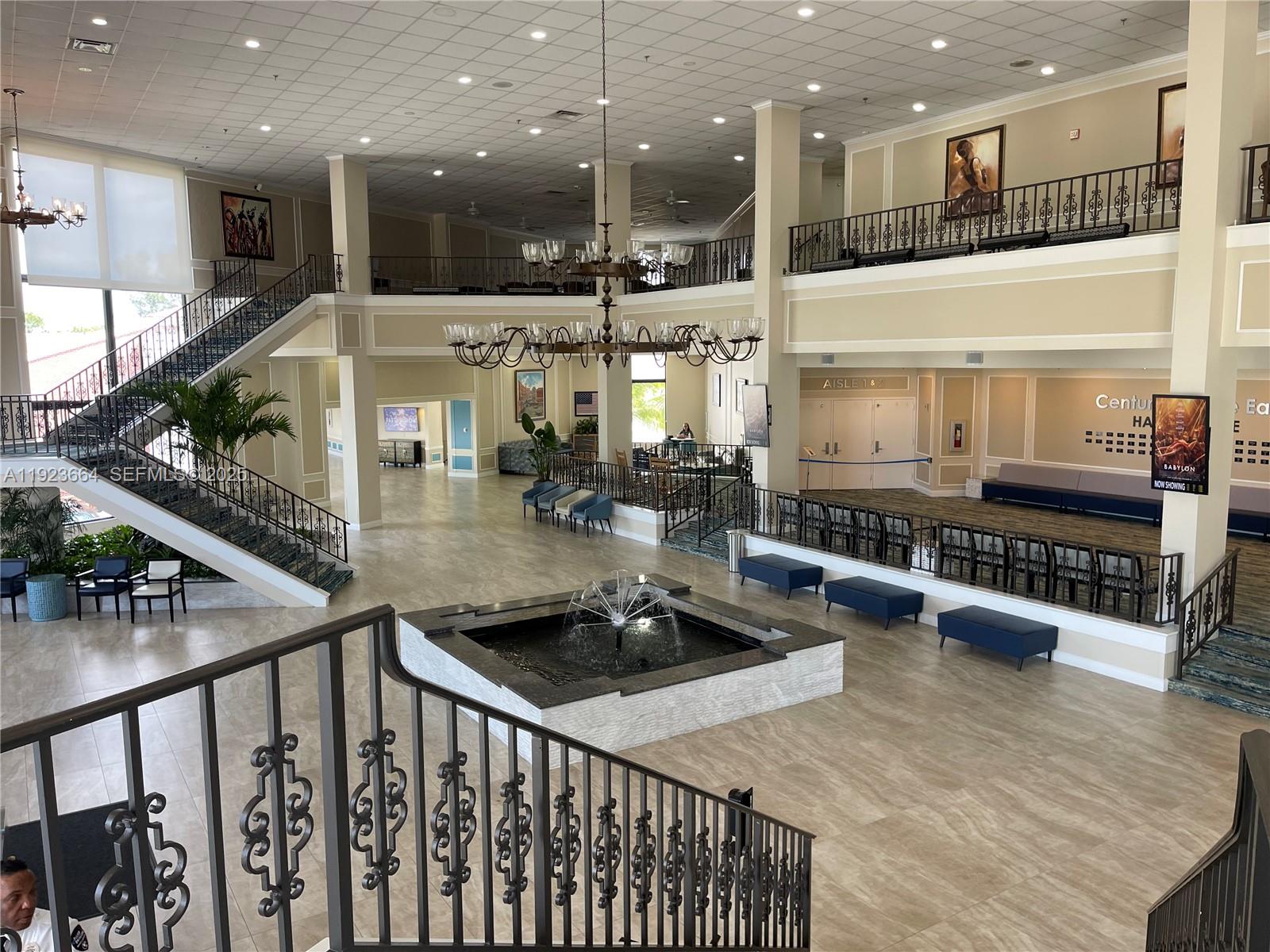 119 Tilford F, Unit 119 Deerfield Beach, FL 33442 - Photo 30 of 36 a kitchen with stainless steel appliances granite countertop a stove and a refrigerator