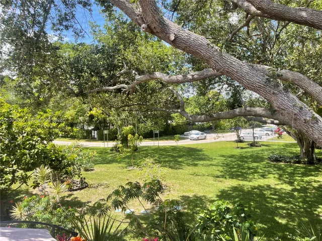 a view of outdoor space with deck and yard