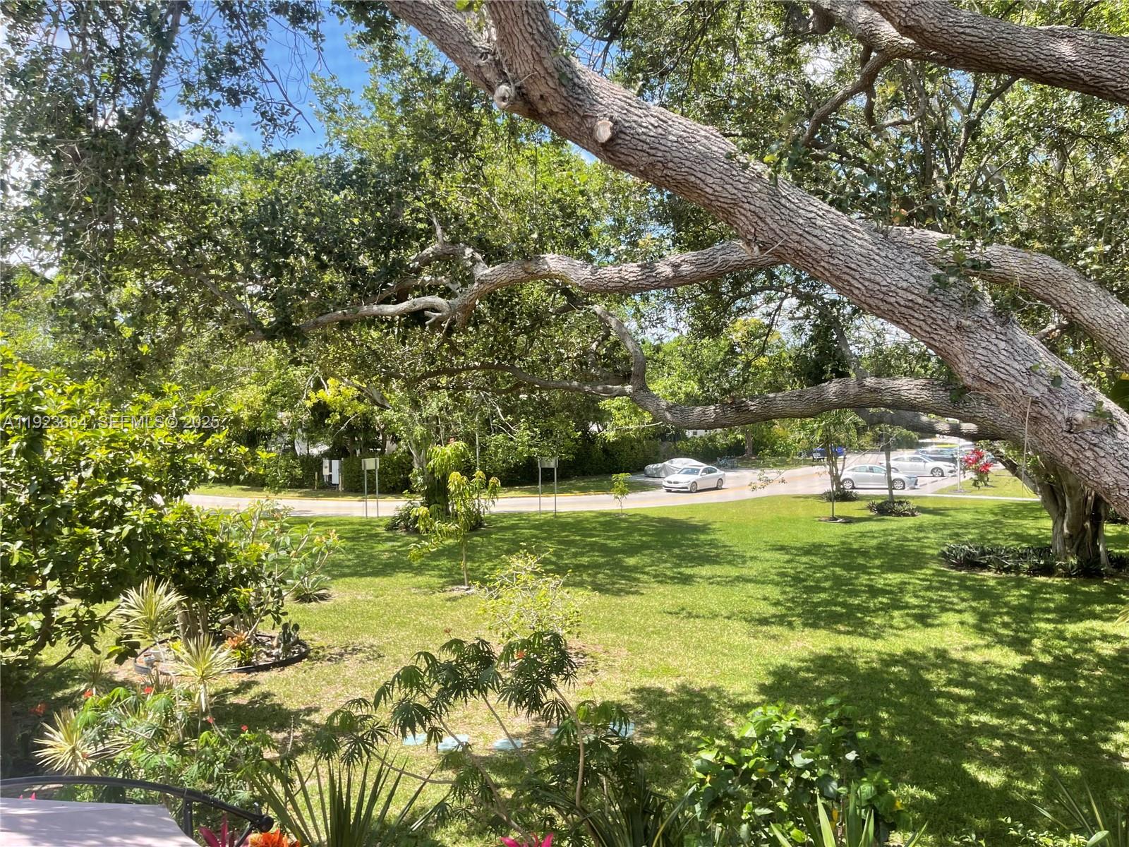 119 Tilford F, Unit 119 Deerfield Beach, FL 33442 - Photo 3 of 36 a view of outdoor space with deck and yard