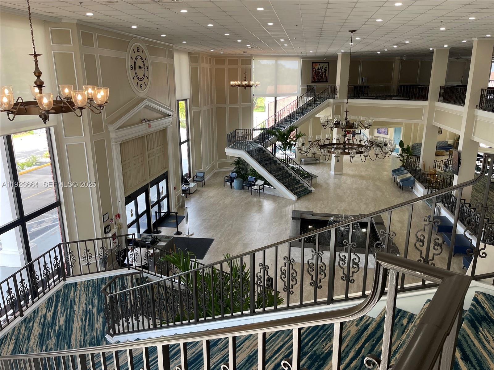 119 Tilford F, Unit 119 Deerfield Beach, FL 33442 - Photo 31 of 36 a living room with furniture and kitchen view
