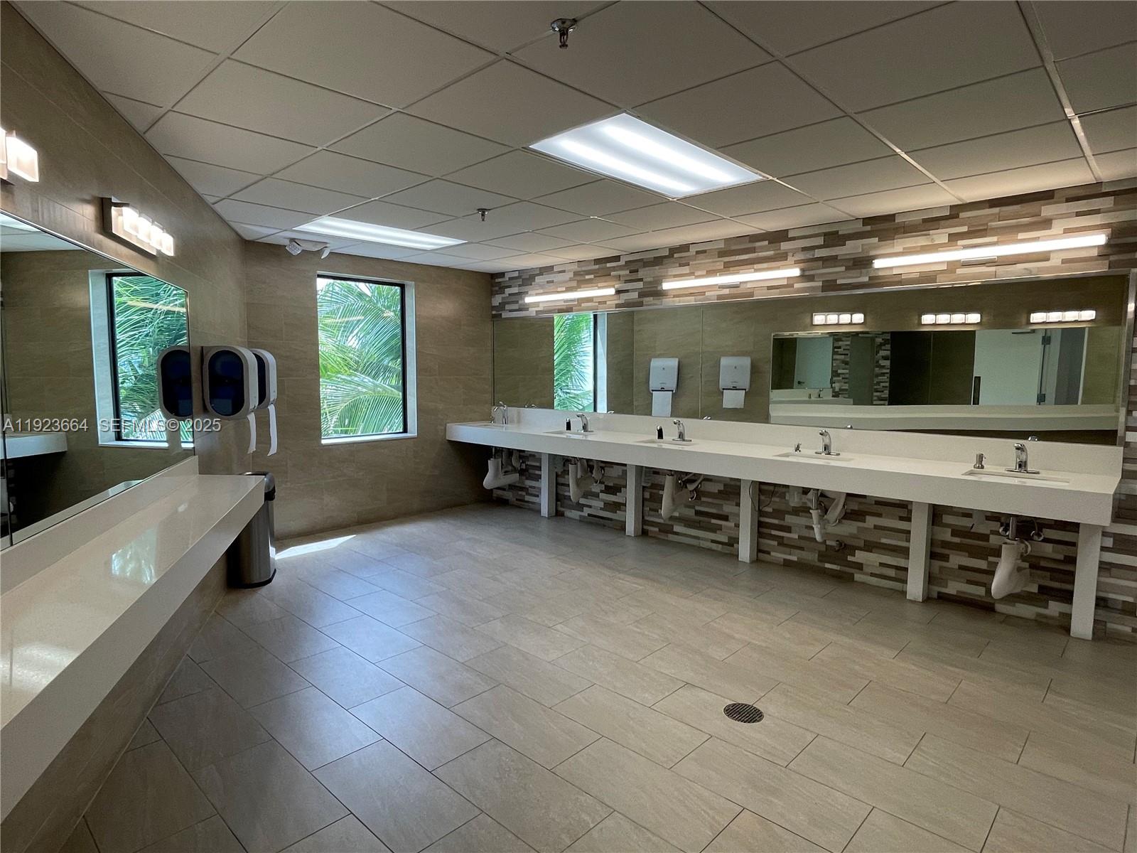 119 Tilford F, Unit 119 Deerfield Beach, FL 33442 - Photo 34 of 36 a large hall with sitting area