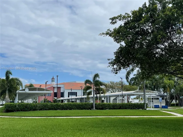 a front view of a building with garden