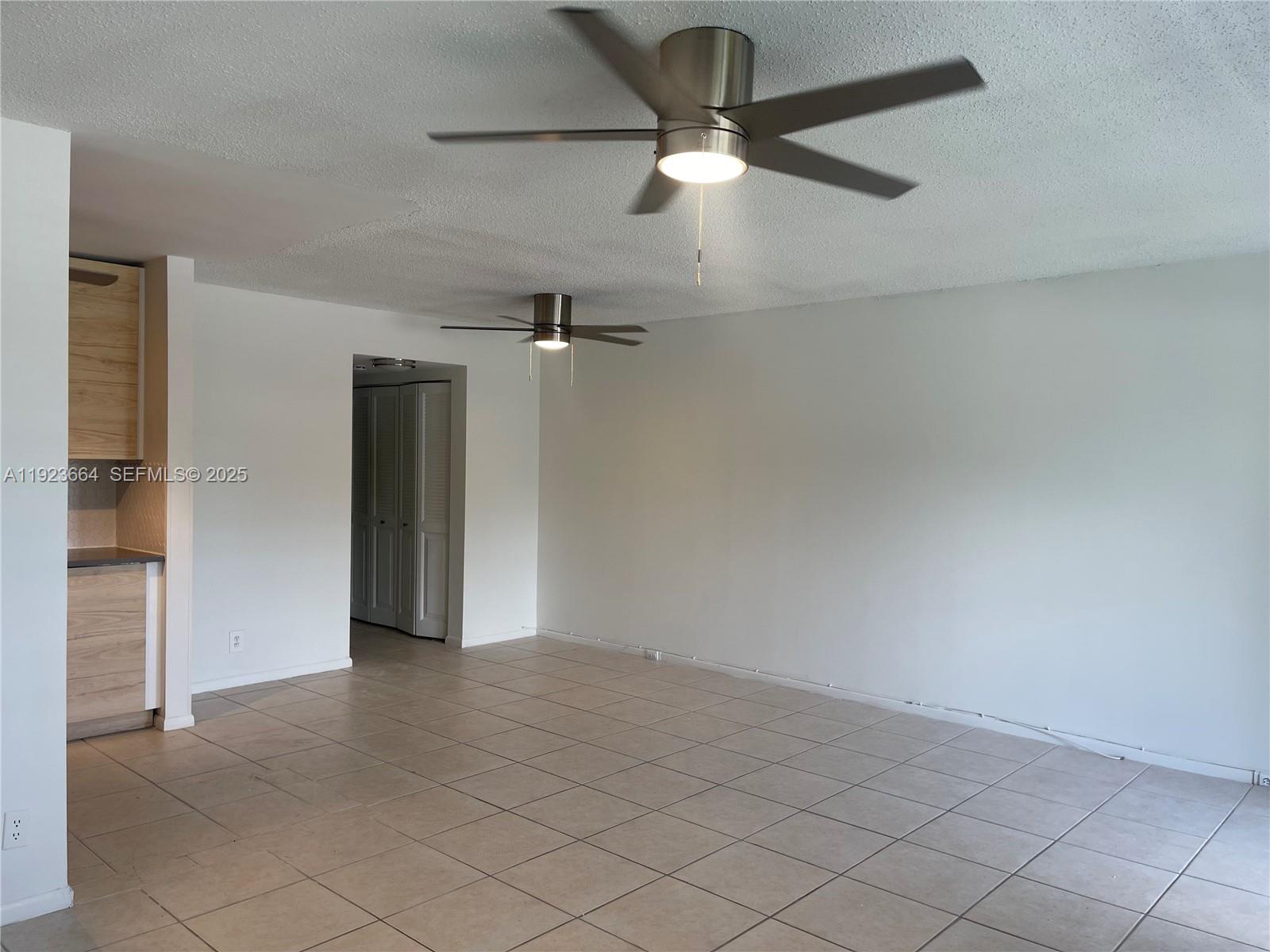 119 Tilford F, Unit 119 Deerfield Beach, FL 33442 - Photo 10 of 36 wooden floor in an empty room