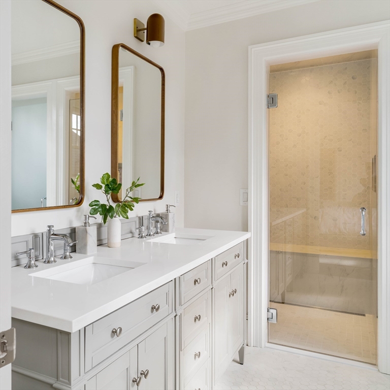 27 Summit Avenue, Unit 2 Brookline, MA 02446 - Photo 18 of 34 a bathroom with double vanity sink and a mirror