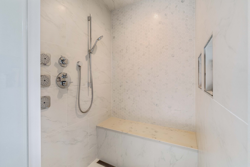 27 Summit Avenue, Unit 2 Brookline, MA 02446 - Photo 20 of 34 a bathroom with a bath tub and shower