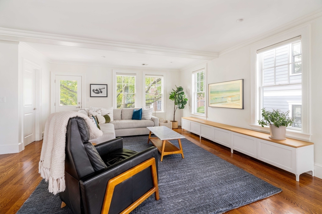 27 Summit Avenue, Unit 2 Brookline, MA 02446 - Photo 2 of 34 a living room with furniture and a large window