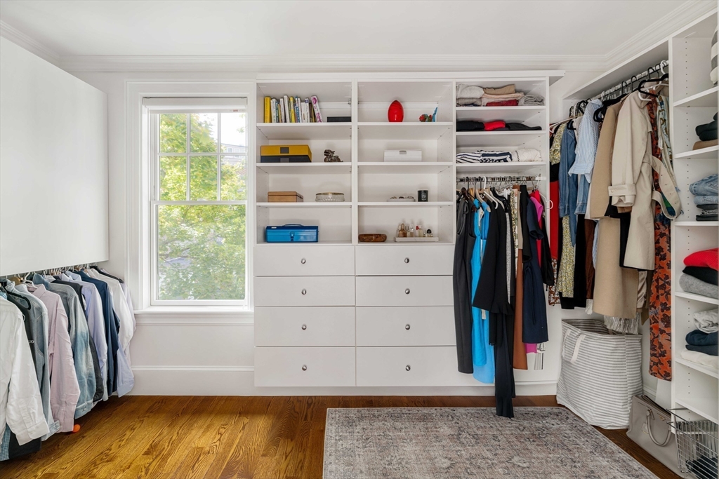 27 Summit Avenue, Unit 2 Brookline, MA 02446 - Photo 21 of 34 a view of walk in closet with clothes and shoes