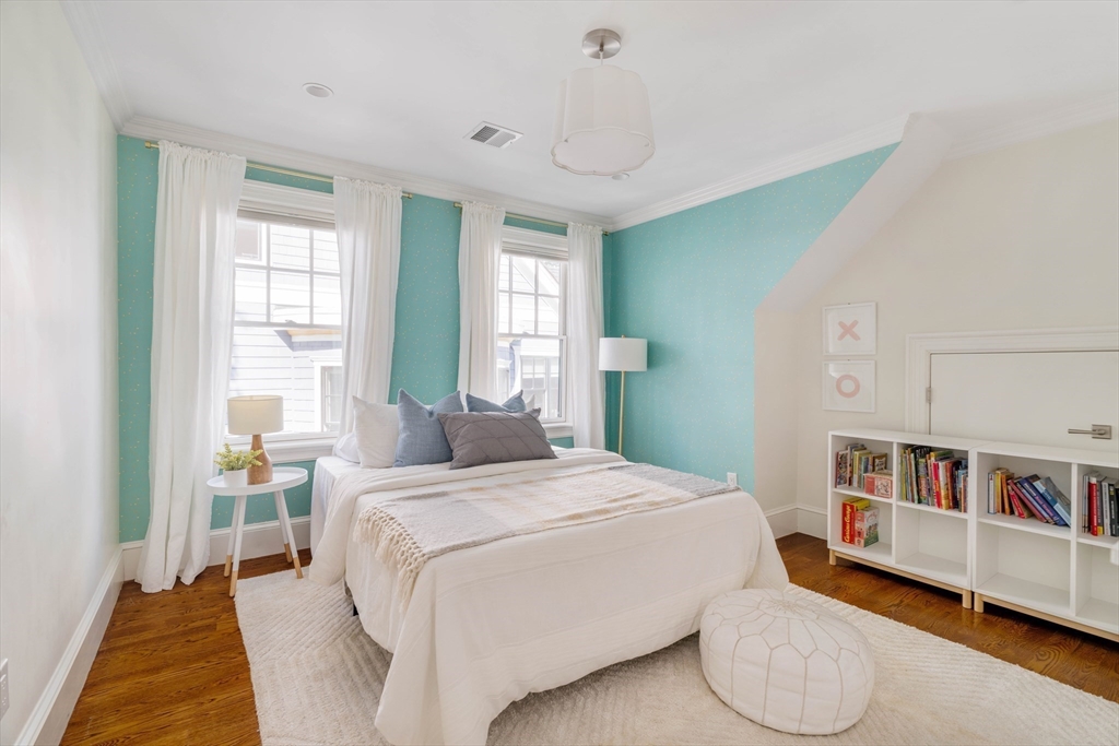 27 Summit Avenue, Unit 2 Brookline, MA 02446 - Photo 22 of 34 a bedroom with a bed and a large window