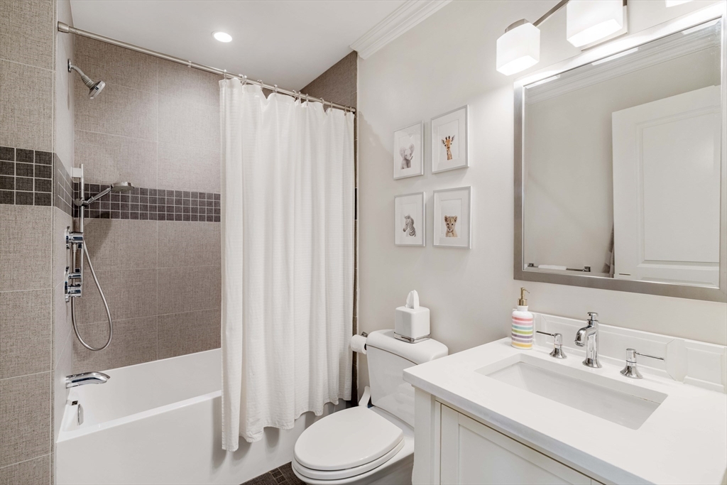 27 Summit Avenue, Unit 2 Brookline, MA 02446 - Photo 30 of 34 a bathroom with a sink toilet and shower