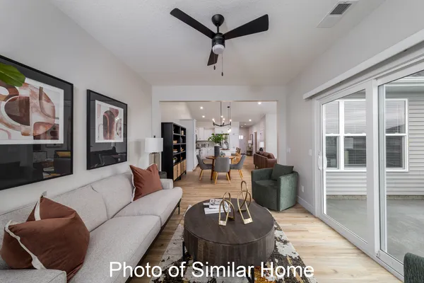 a living room with furniture and a window