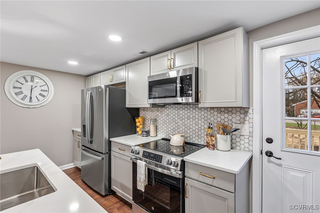 9531 Reams Road Chesterfield, VA 23236 - Photo 15 of 34 a kitchen with stainless steel appliances granite countertop a sink stove and refrigerator