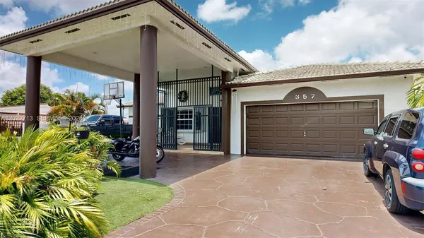 a view of front door and potted plants