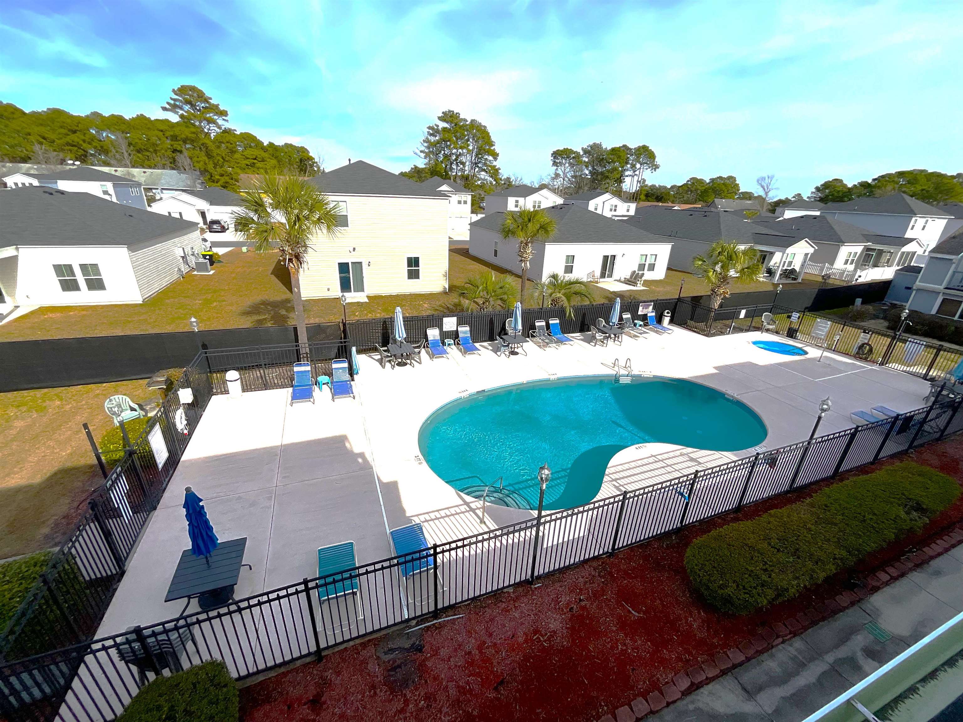 1880 Colony Drive, Unit 11O Surfside Beach, SC 29575 - Photo 14 of 17 Community pool featuring a patio and a residential view